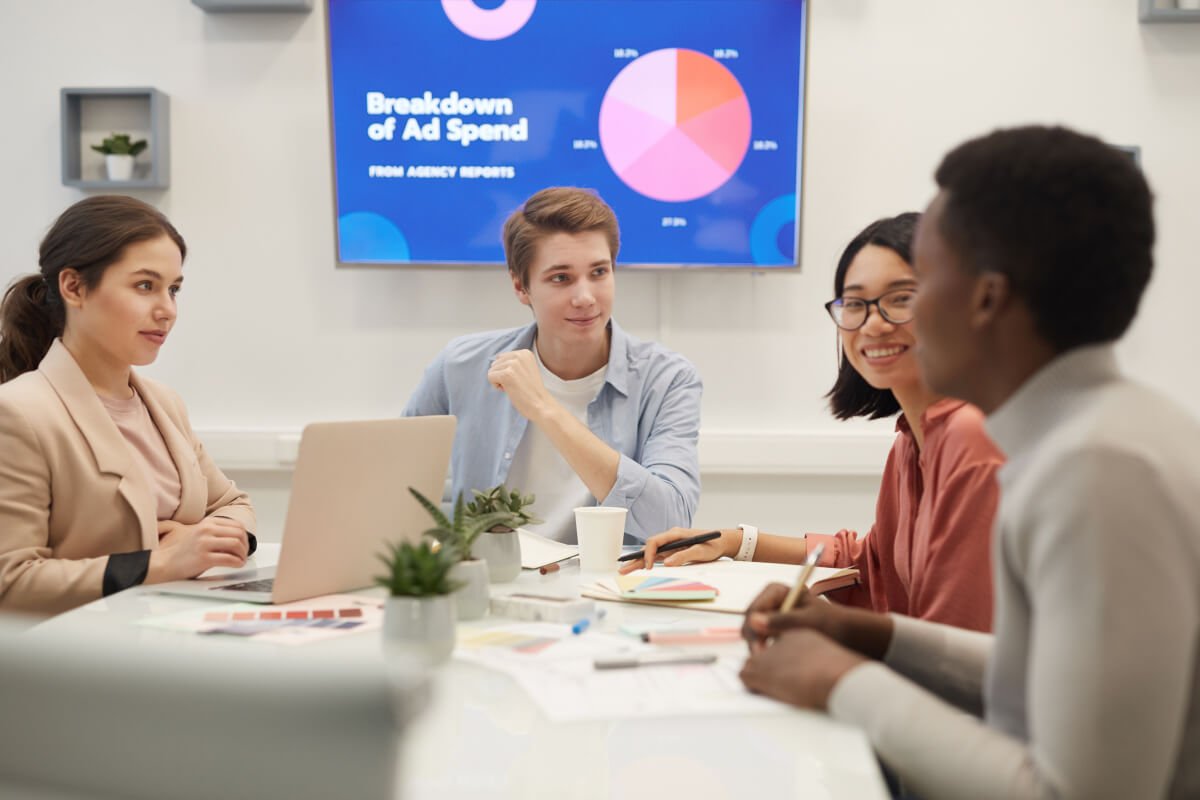young-people-discussing-marketing-in-meeting-DUKKGYJ.jpg
